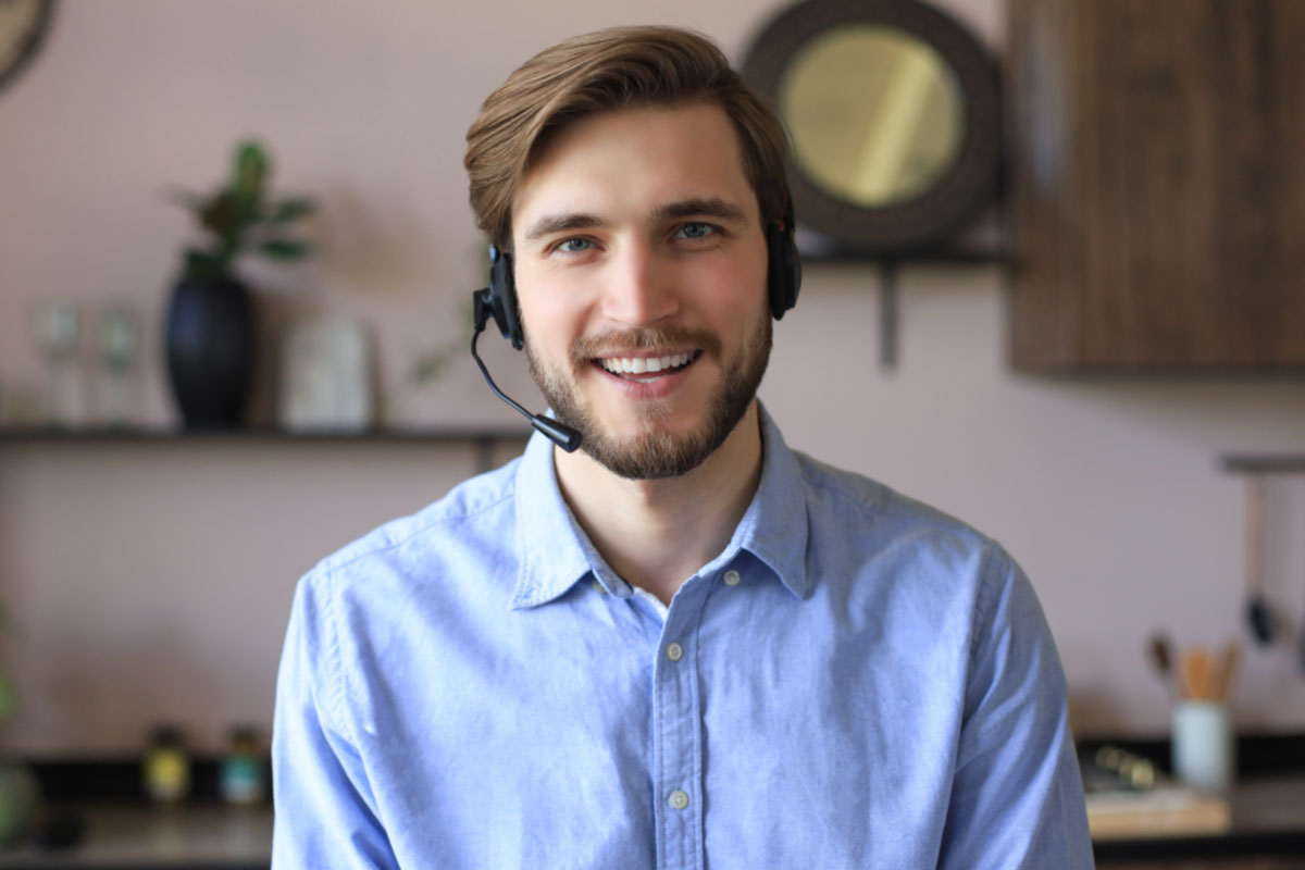 Contact center agent smiling working from home
